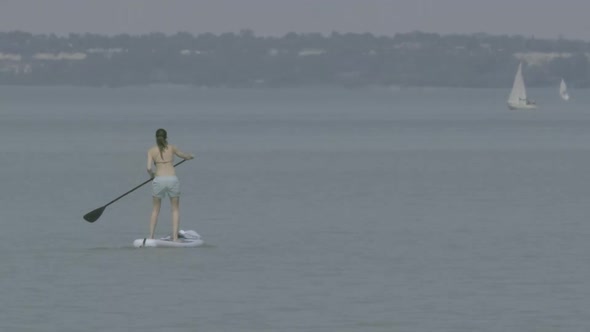 A young girl goes over on the Lake Balaton.