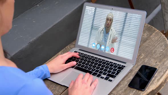 Woman talking on video meeting on her laptop