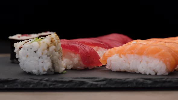 Japanese Asian food sushi nigiri, tuna, hosomaki, uramaki assortments on a plate