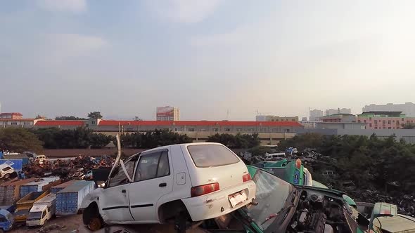 Vehicles Piled Up at Scrap Yard. alt