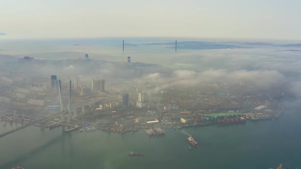 Golden Bridge and Russian Bridge at Dawn Mist in Vladivostok City