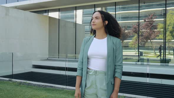 Video Portrait of Successful Pretty Hispanic or Brazilian Curly Haired Young Stylish Woman Mixed