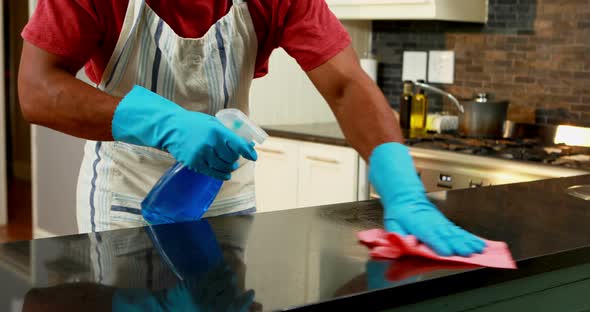 Man cleaning the kitchen worktop 4k