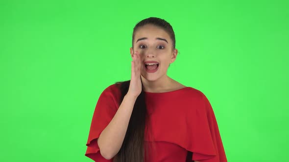 Portrait of Pretty Young Woman Is Screaming Calling Someone. Green Screen