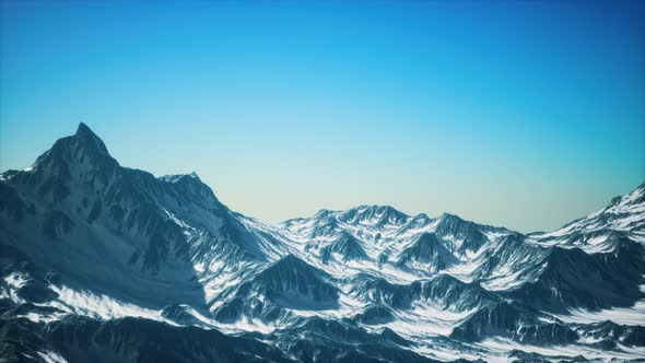 Aerial View of the Alps Mountains in Snow