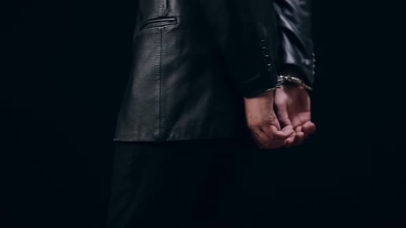 Close Up of Male Hands in Handcuffs