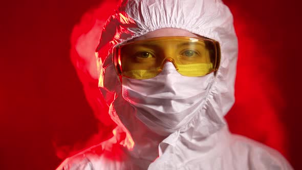 A Medical Professional Shows a Warning Sign at the Entrance To the Quarantine Zone