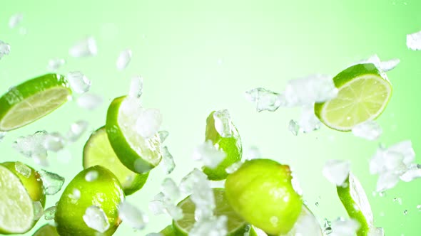 Super Slow Motion Shot of Flying Fresh Lime Slices and Crushed Ice at 1000 Fps