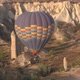 Colourful Hot Air Balloon with Basket Flies Over Cliffs - VideoHive Item for Sale