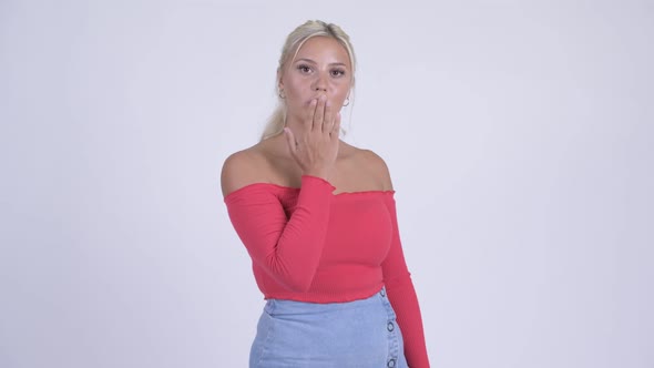 Happy Young Beautiful Blonde Woman Blowing Kiss