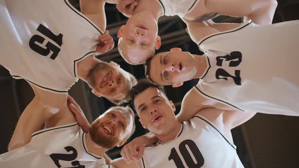 Slow Motion Team of Basketball Players Shouts Chants and Raising Morale Before the Game the