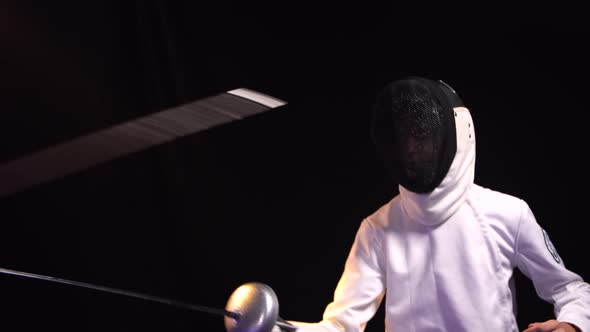 A Young Guy Fights a Duel Participating in a Fencing Tournament