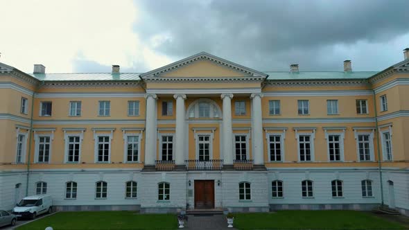 Aerial Shot City Mezotne, Latvia Republic. Mezotne Palace and Park With Fountain. Lielupe River With