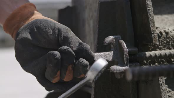 Construction workers preparing steel concrete molds