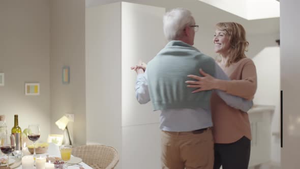 Romantic Senior Couple Dancing at Home