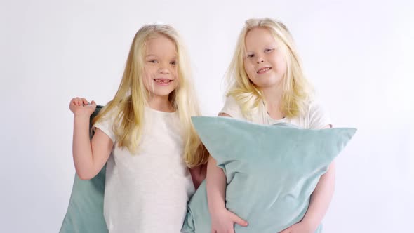 6-year-old Caucasian Twins Posing with Pillows