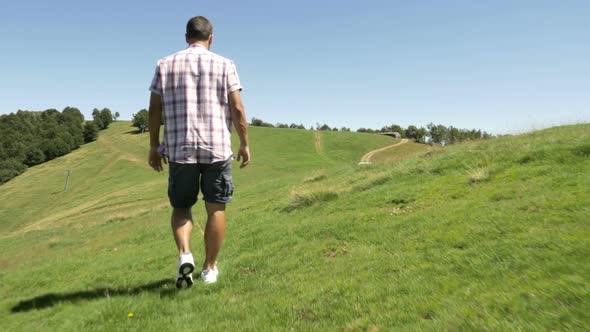 Back View of Young Man Hiking in Mountain Outdoor Nature Scenery During Sunny Summer Day Gimbal