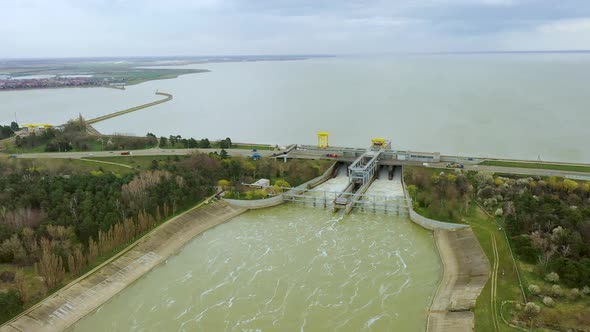 View From Above of the Water Rushing Through the Gates of the Dam at the Krasnodar Reservoir