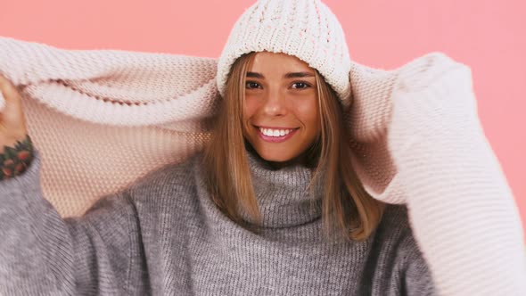 Woman in Sweater and Hat is Feeling Cold