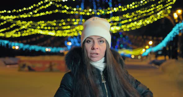 Beautiful Girl Dancing and Having Fun in the Park in Winter Evening