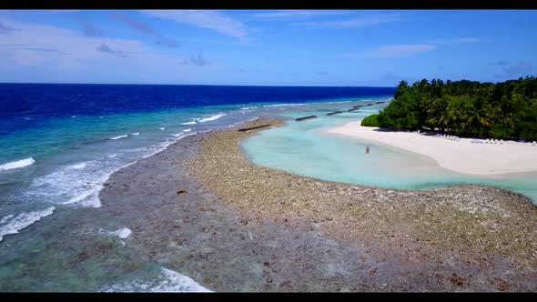 Aerial above scenery of tranquil coast beach holiday by blue sea and white sandy background of a day