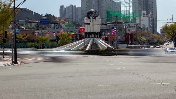 Timelapse Famous Busan Statue Surrounded By Flags and Cars