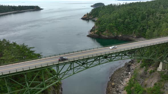 Aerial shot pulling away from the Deception Pass bridge on Fidalgo Island.