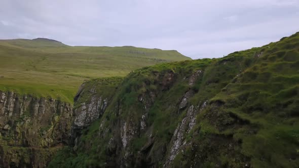 Green Cliffs of Faroe Islands in Cloudy Weather