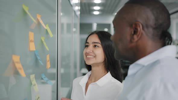 Business Team Colleagues Diverse Coworkers Discusses the Project Together Choose Sticky Notes Paper