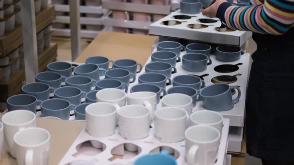 Close Up of Woman Choosing New Mug in a Store