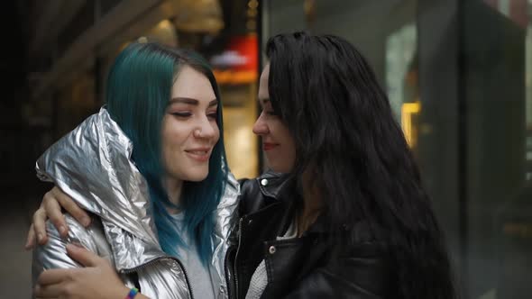 Tender LGBT Couple Hugs and Smiles in Public