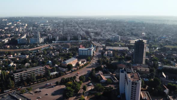 Drone Flies Forward Over Industrial City