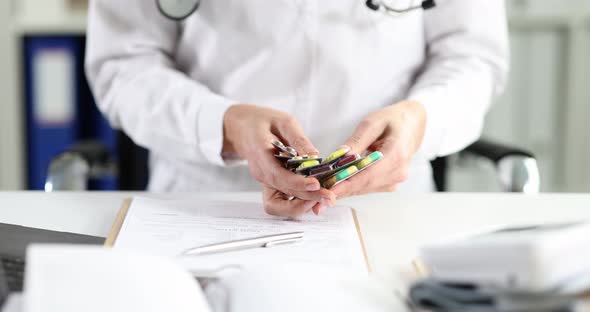 Various Medicines in Doctor Hands in Clinic