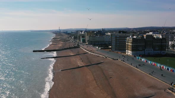 Drone shot of Hove beach and cityscape in East Sussex, England, UK