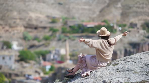 Young Woman on the Edge of Canyon in Cappodocia