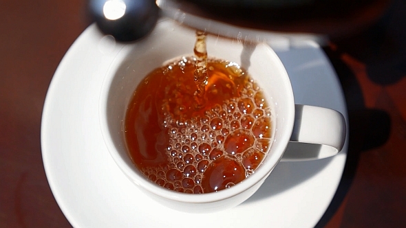 Pouring Tea in Cup