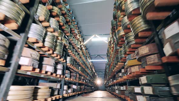 Passage Between Stacks with Plenty of Old Film Cases