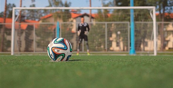 Soccer Player Scores a Goal