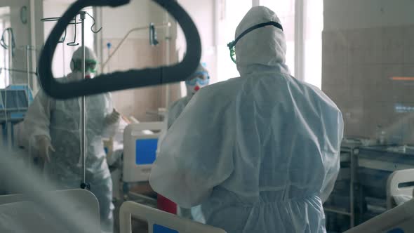Group of Doctors Wearing Safety Suits in a Covid19 Hospital Ward Coronavirus Emergency Care Unit