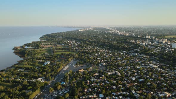 Aerial establishing shot of San Isidro coastal neighborhood and nautical club. Dolly in