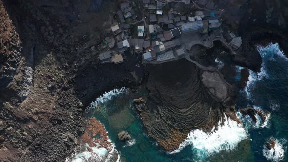 Vertical down aerial lift up over Atlantic ocean coastline, El Hierro