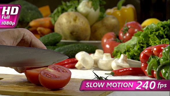 Knife Cutting Tomato