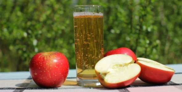 Pouring Fresh Apple Juice Outdoors