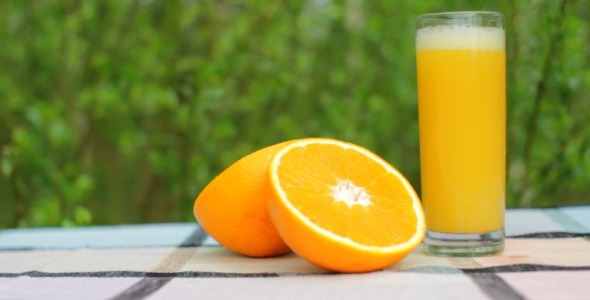 Pouring Fresh Orange Juice Outdoors