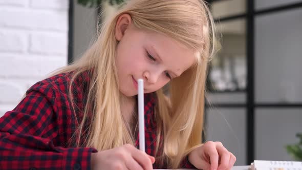 Blonde Schoolgirl Studying at Home Doing School Homework