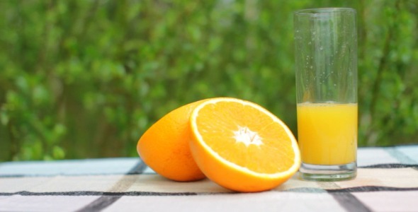 Drinking Fresh Orange Juice Outdoors
