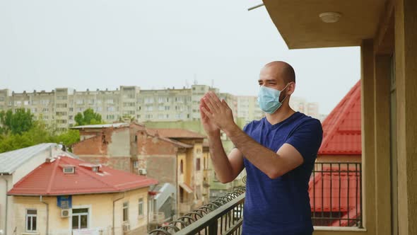 Cheerful Man with Mask Clapping alt
