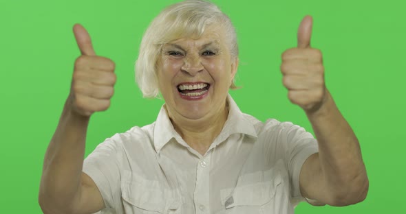 An Elderly Woman Show Thumb Up and Smiles. Old Grandmother. Chroma Key