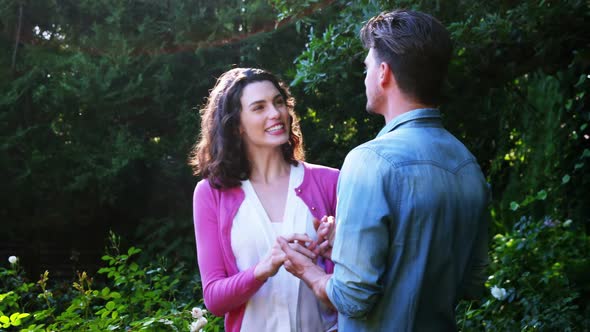 Romantic couple interacting with each other in garden