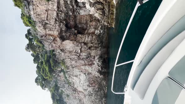 Entering a cave on the sea with a speedboat in Kolocep, Croatia.